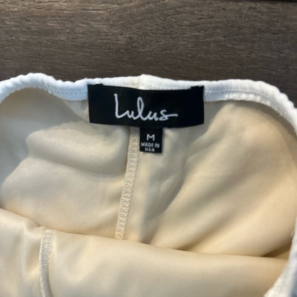 Lulus white jumpsuit crisscross open back.  No zippers.  Worn once